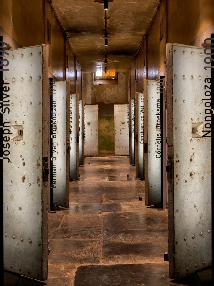 Cell corridor with name panels, The Old Fort