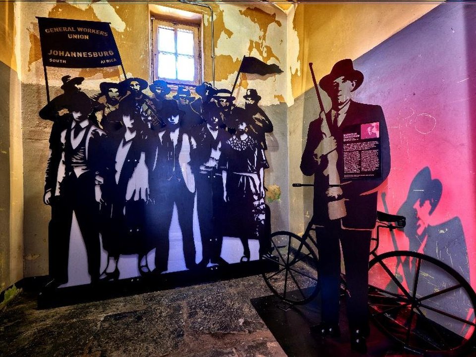 Group scene with steel figures and coloured light