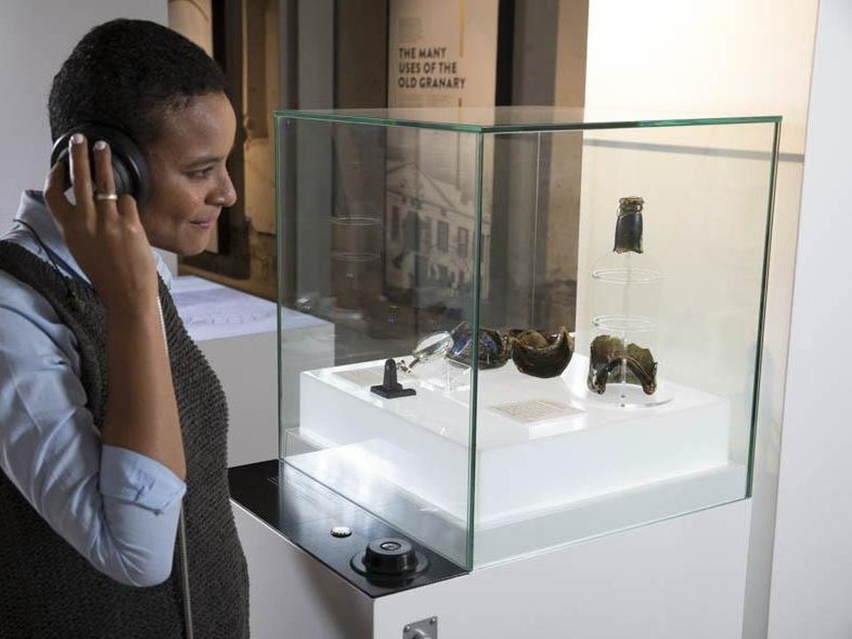 Visitor with headset at talking objects display